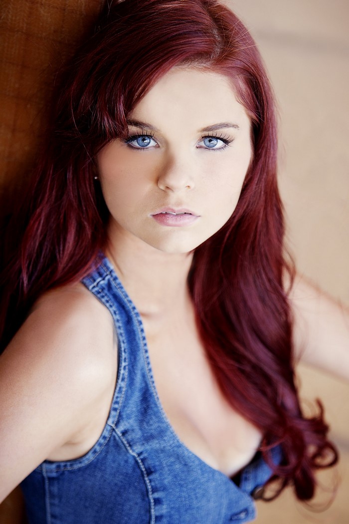 Redhead woman with blue eyes in denim