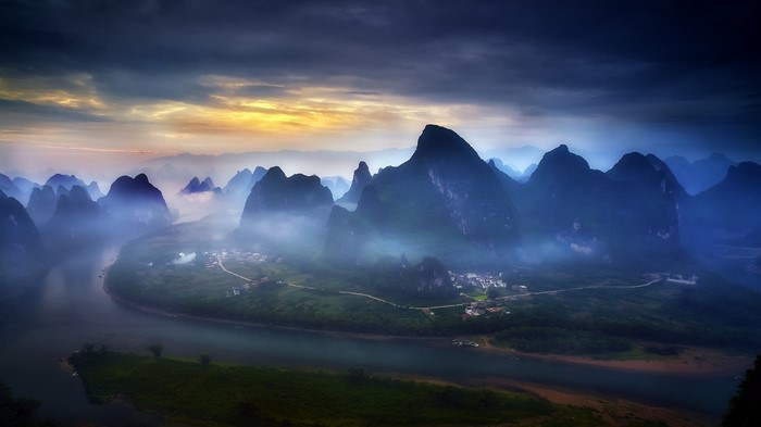 Misty Mountains and River at Sunrise in Guilin, China