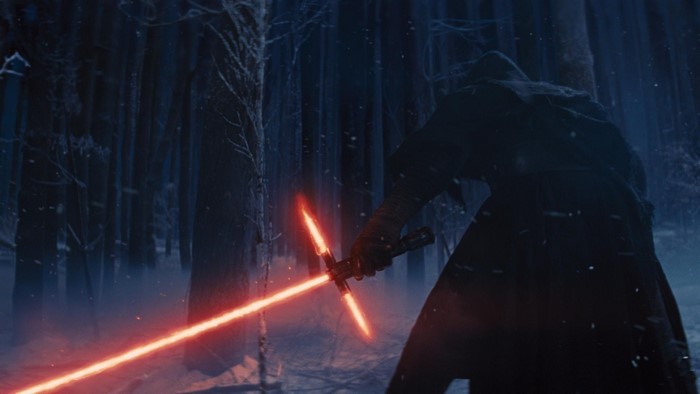 Kylo Ren from Star Wars with lightsaber in forest