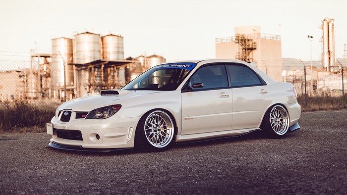 White Subaru Impreza WRX STI with custom wheels