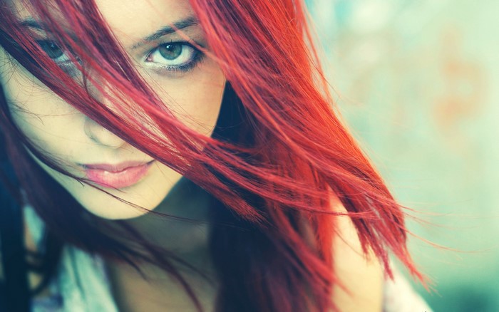 Woman with red hair and green eyes