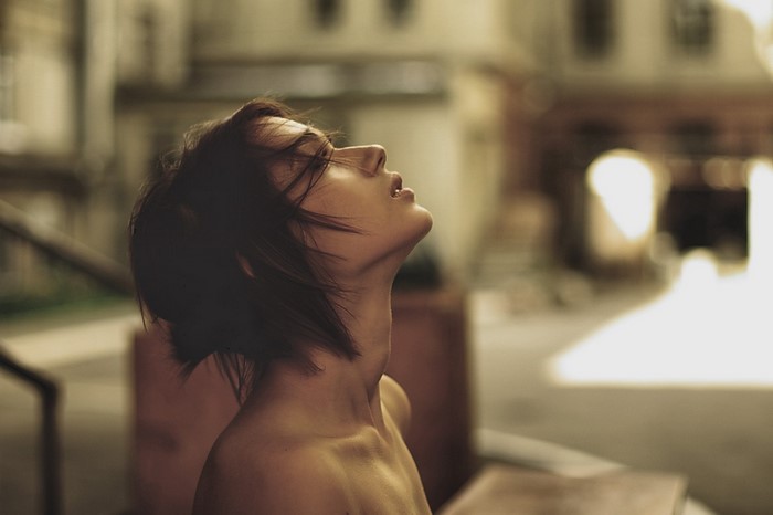 Woman with short hair looking up