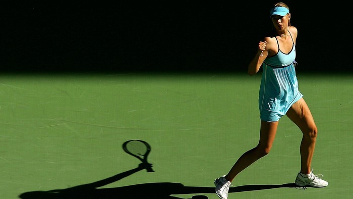 Maria Sharapova playing tennis on a court