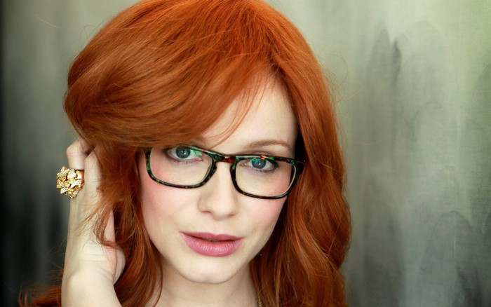 Christina Hendricks wearing glasses and a ring