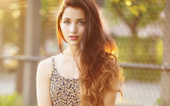 Emily Rudd with long brown hair and blue eyes