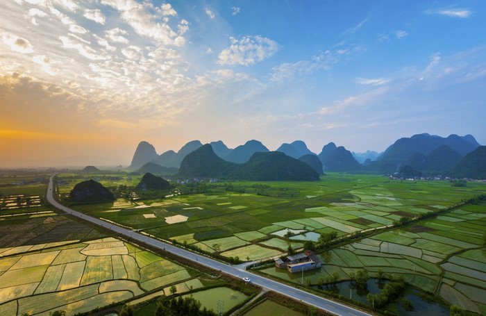 Rice paddies and karst mountains at sunset in Guilin, China