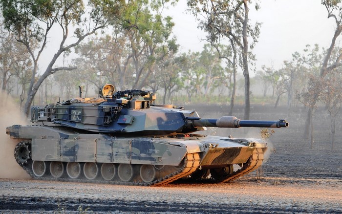 M1 Abrams tank in a wooded area