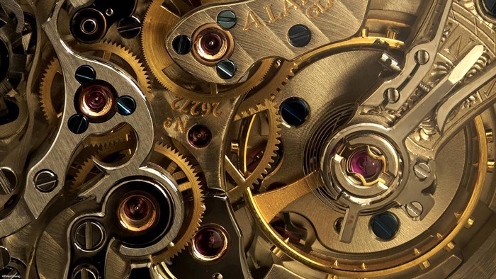Close-up of a vintage watch movement with gold gears