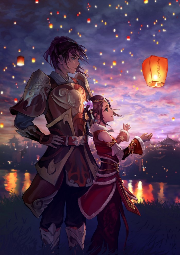 Couple watching sky lanterns at dusk