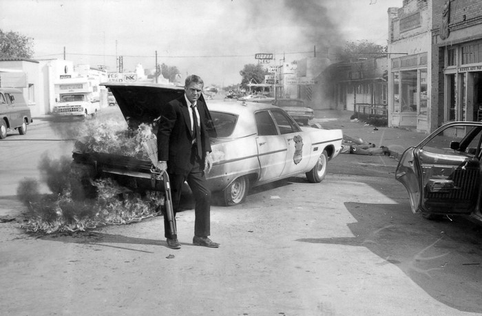 Steve McQueen in a burning car scene