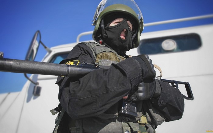Russian soldier with assault rifle and helmet