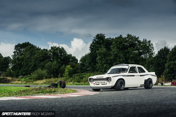 White Ford Escort race car on a track