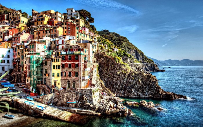 Colorful buildings on a cliffside overlooking the sea in Cinque Terre, Italy