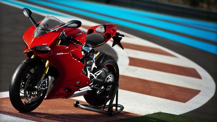 Red Ducati 1199 Panigale motorcycle on race track