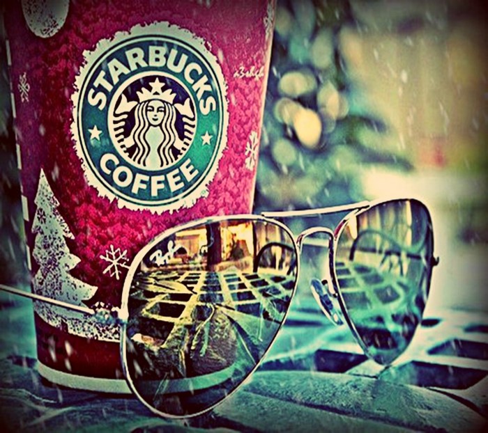 Starbucks coffee cup and sunglasses