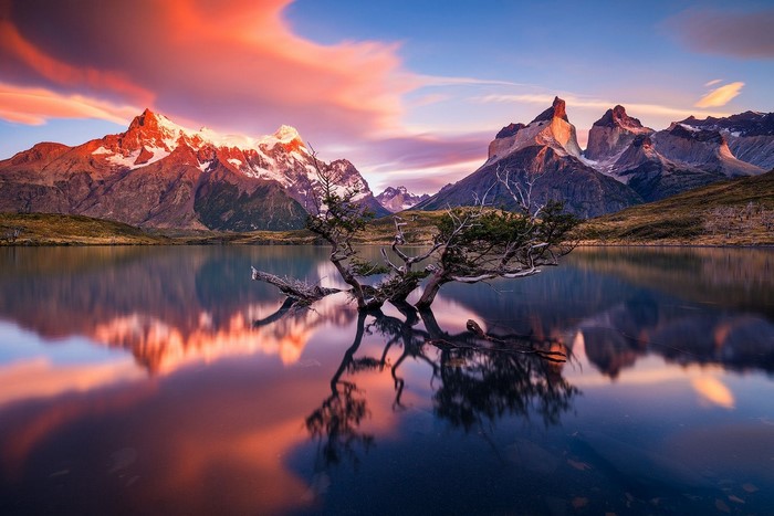 Torres del Paine National Park at sunrise with lake reflection