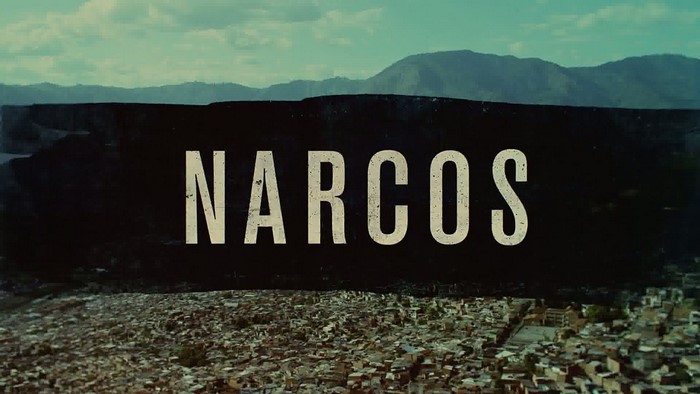 Narcos title card with city and mountains