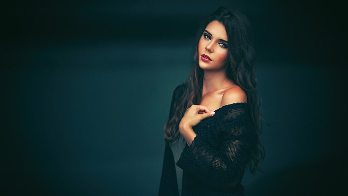 Woman with dark hair and red lipstick