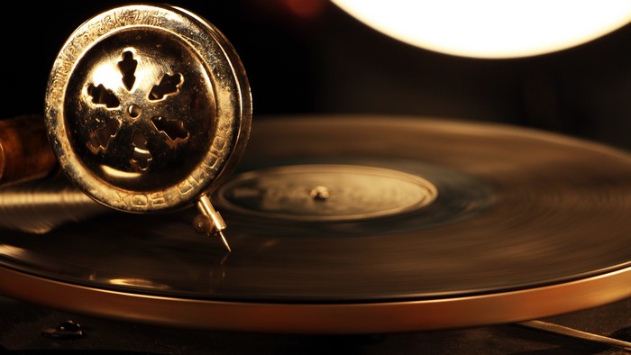 Vintage gramophone needle on a spinning vinyl record