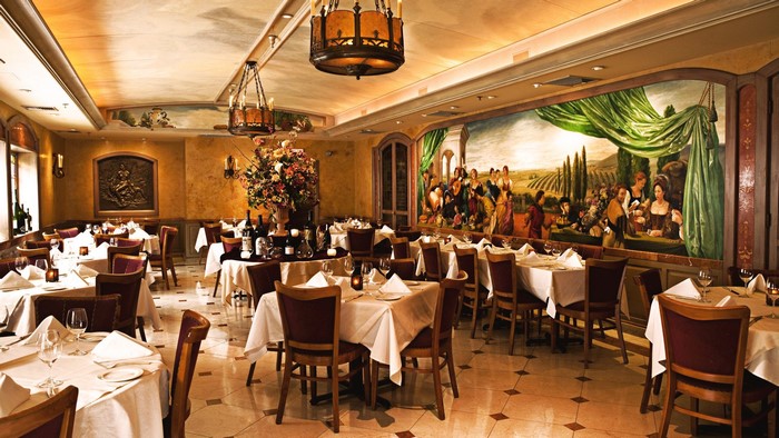 Restaurant dining room with tables and mural