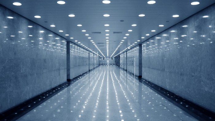 Modern Hallway with Marble Walls and Ceiling Lights