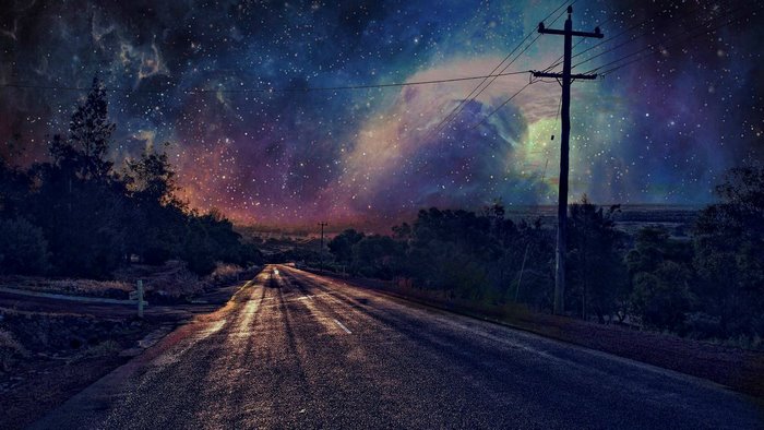 Night road under starry sky with utility pole