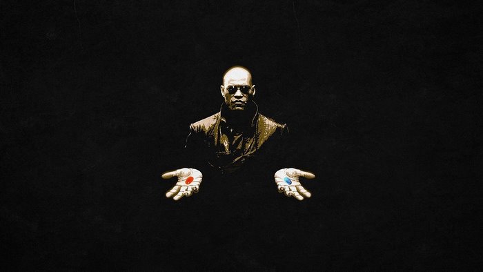 Morpheus from The Matrix holding red and blue pills