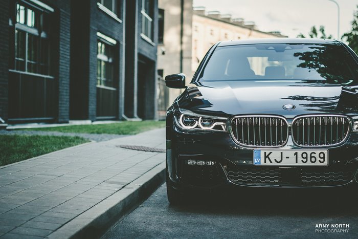 Black BMW 7 Series car with license plate KJ-1969 in Riga, Latvia