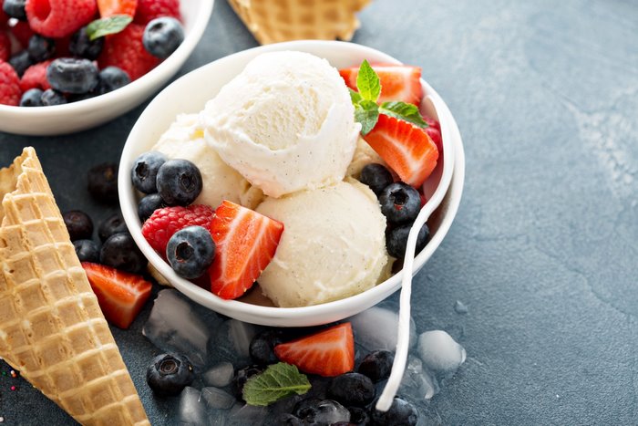 Vanilla ice cream with berries and waffle cone