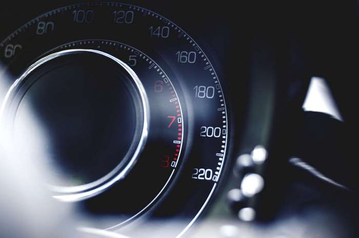 Close-up of a car's speedometer and tachometer