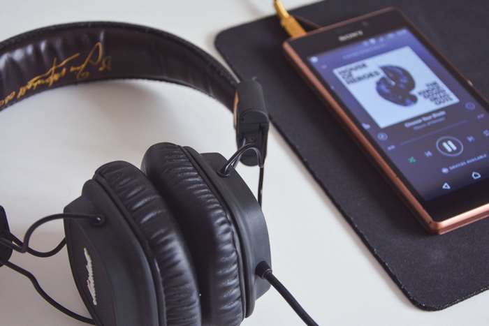 Sony smartphone playing music with headphones