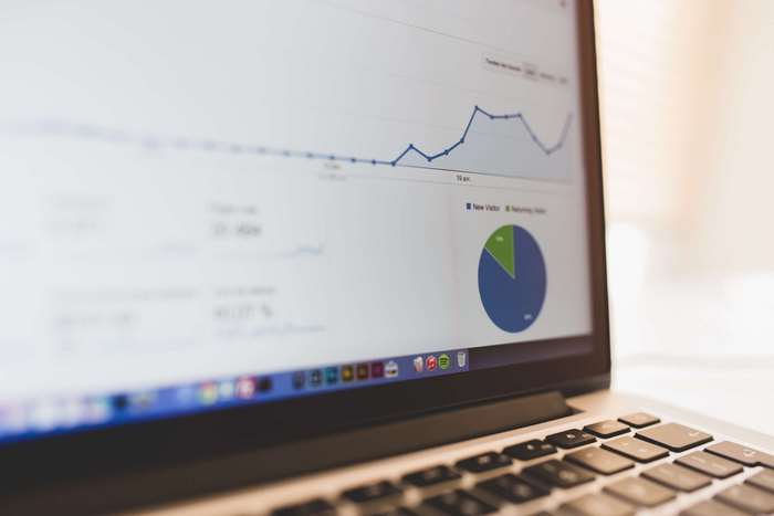 Laptop displaying analytics charts and graphs