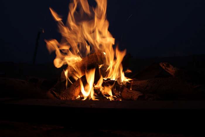 Campfire with flames at night 4K