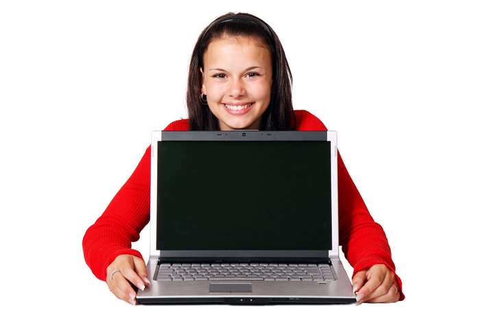 Young woman smiling with a laptop