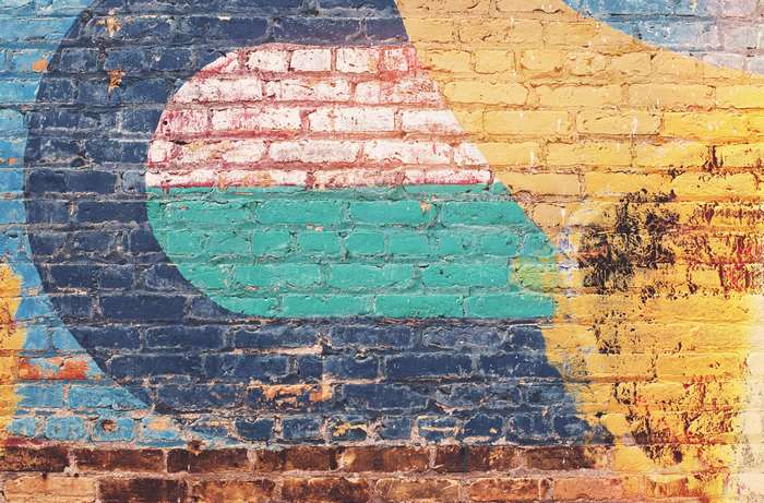 Abstract colorful street art on a brick wall 4K