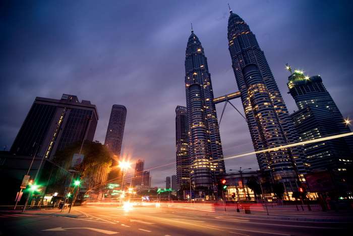 Petronas Towers in Kuala Lumpur at night with light streaks