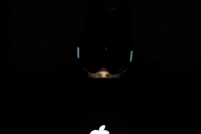 Person wearing goggles with Apple logo