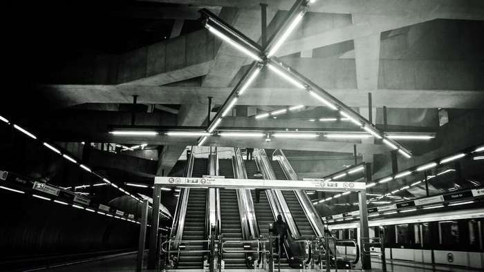 Modern Metro Station with Escalators and Train