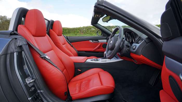 BMW Z4 convertible interior with red seats 4K