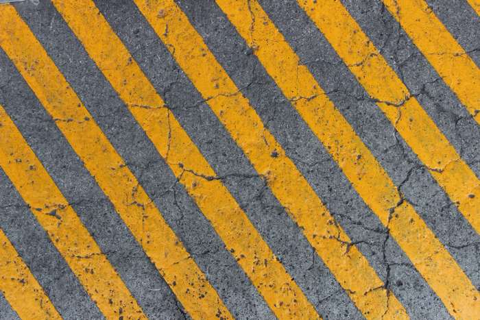 Yellow and gray hazard stripes on concrete
