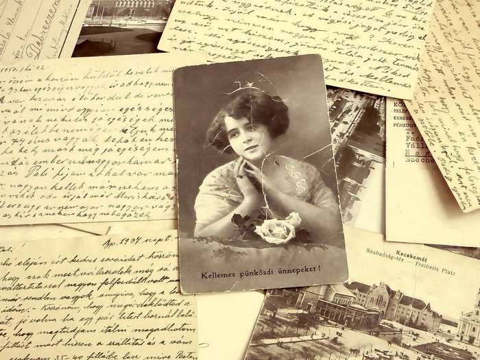 Old letters and a woman's portrait postcard