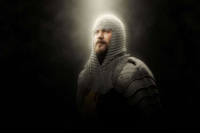 Man in chainmail armor with light rays