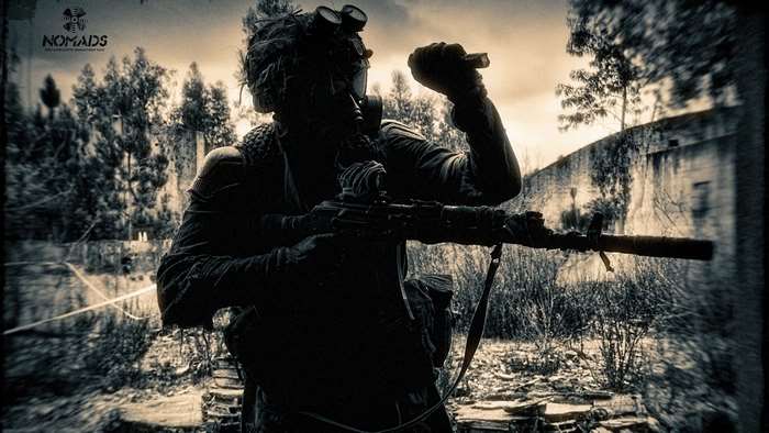 Post-apocalyptic soldier with rifle and gas mask