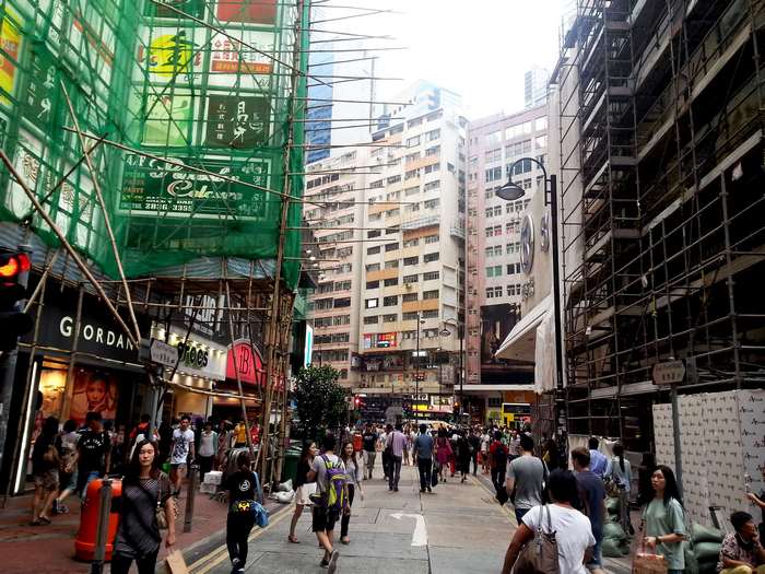 People shopping on a busy street in Hong Kong