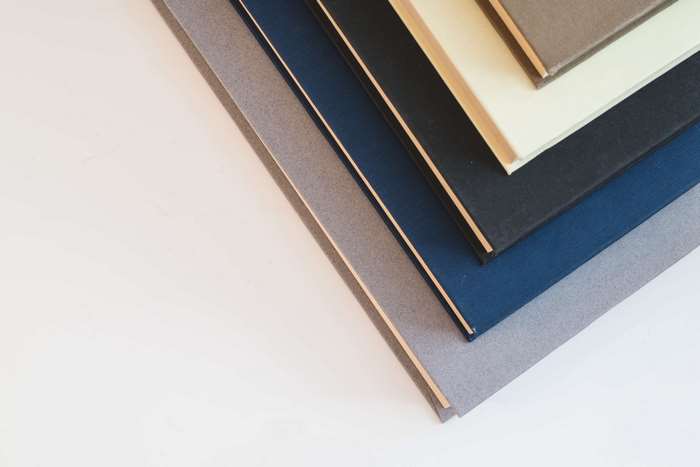 Stack of hardcover books with different colored covers