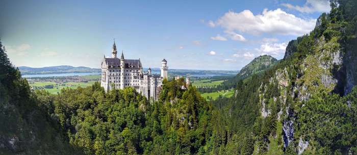 Neuschwanstein Castle panorama with Alps and lake