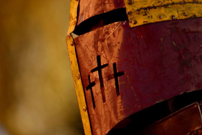 Close-up of a medieval knight's helmet with crosses