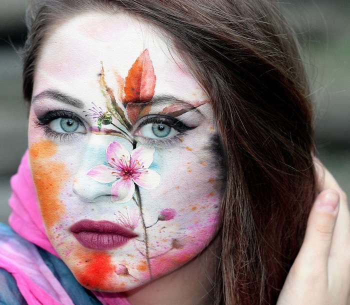 Woman with painted face and flowers