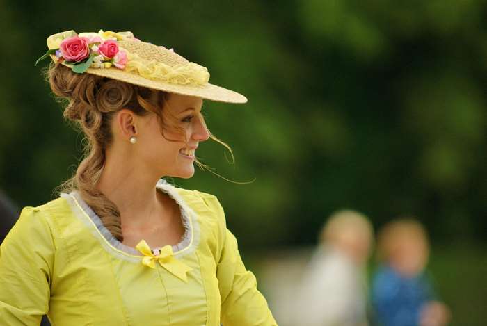 Woman in a yellow dress and a straw hat