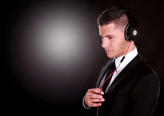 Man in suit wearing headphones